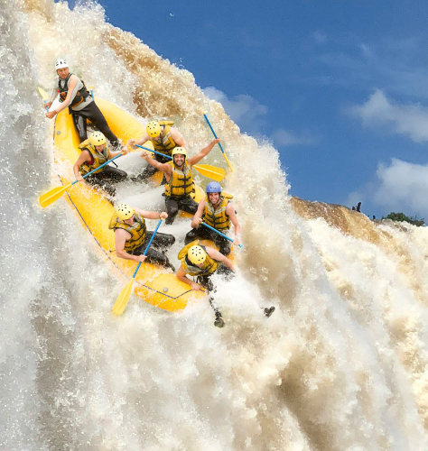 Happy rafters going over a huge waterfall